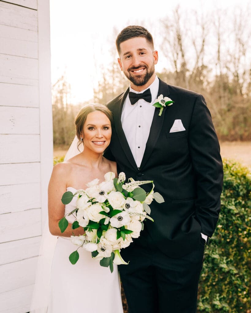 Portrait of Abby and Daniel in front of The Chapel for their wedding at Plein Air in Taylor, MS