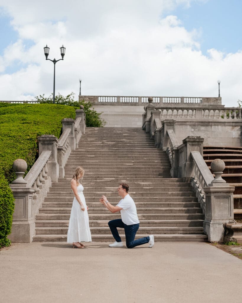 Cincinnati surprise engagement in front of the stairs of Ault Park Pavilion